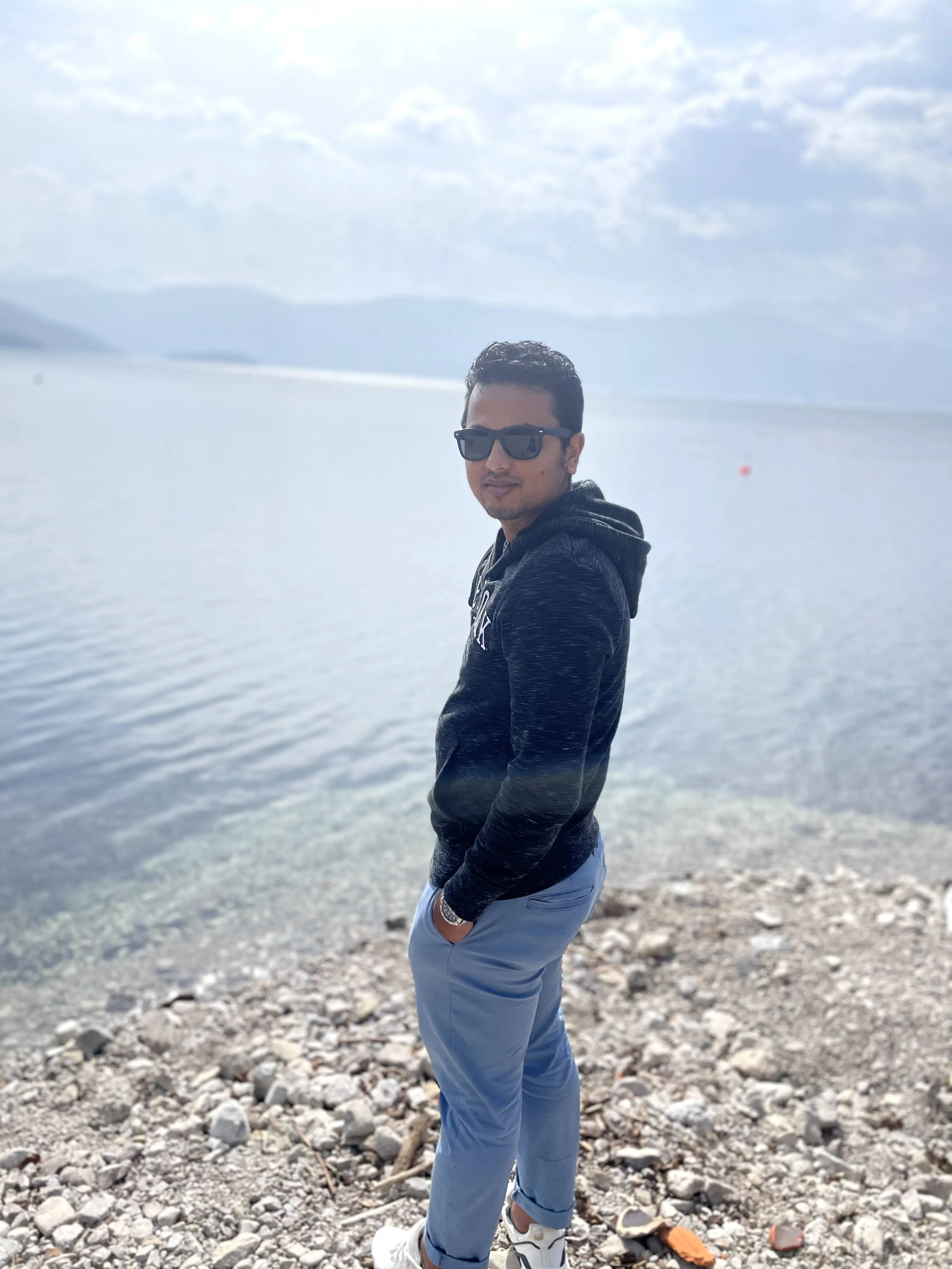 Noor Hakeem by a lake